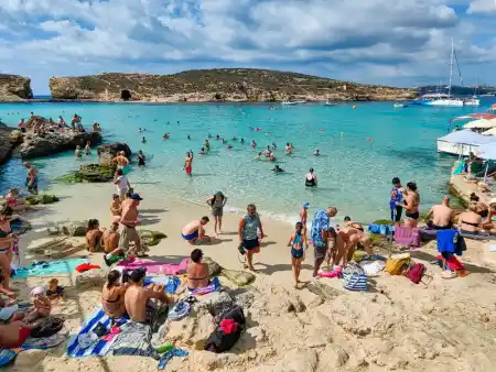 Blue lagoon out of season in the morning, in the background of the Cominotto mini-island