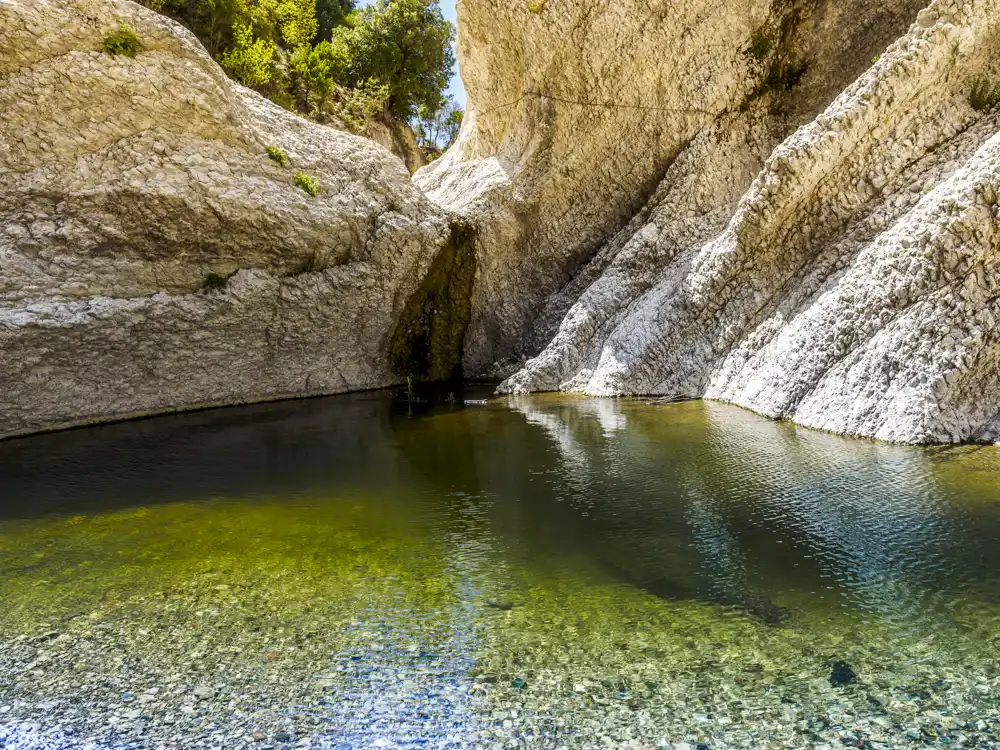 small emerald-green pool