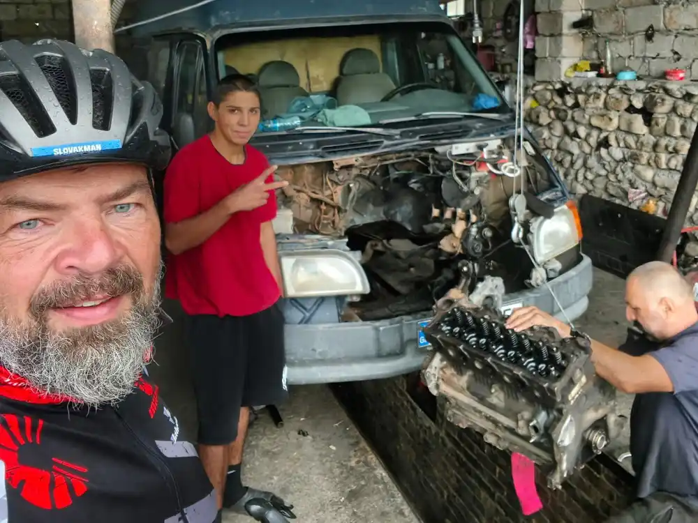 I waited out the first downpour in some car-mechanic’s workshop