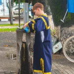 A boy changing wine to water