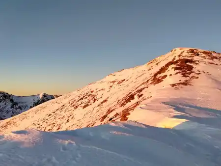 The peak of Baranec bathed in the evening sun
