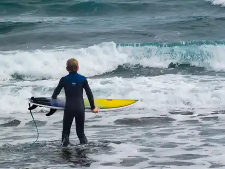 Arrieta Beach surfers