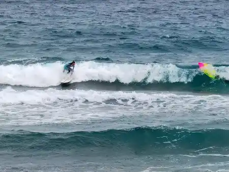 Arrieta Beach surfers